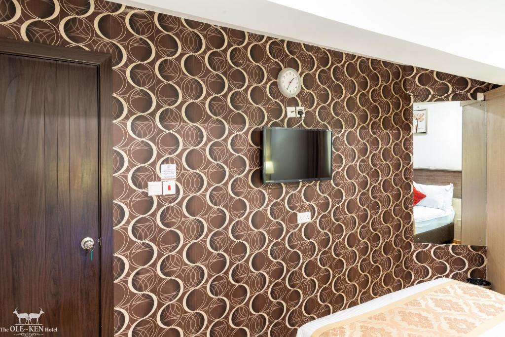 Postel nebo postele na pokoji v ubytování The Ole-Ken Hotel