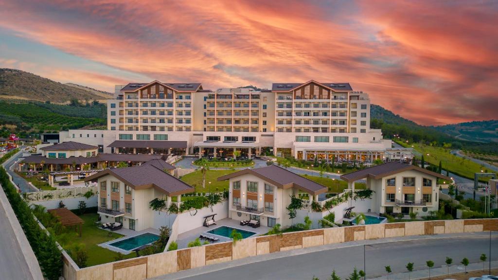 an aerial view of the resort at sunset at BN Hotel Thermal & Wellness in Mersin