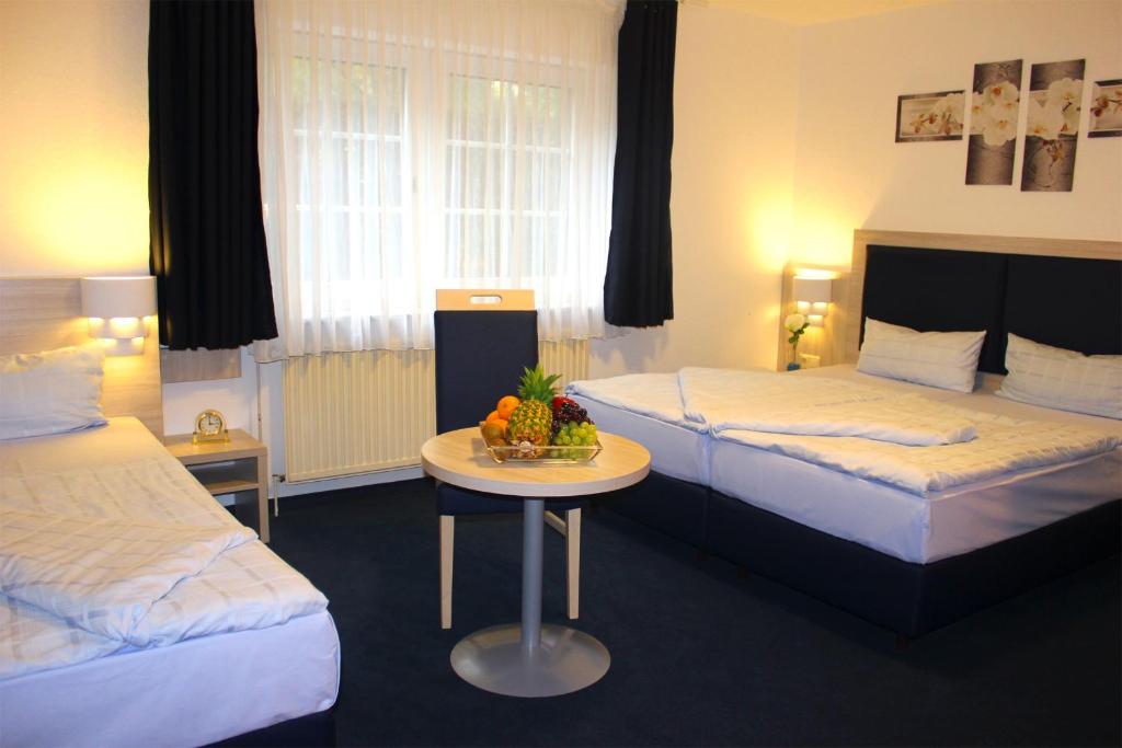 Postel nebo postele na pokoji v ubytování Hotel Altenwerder Hof