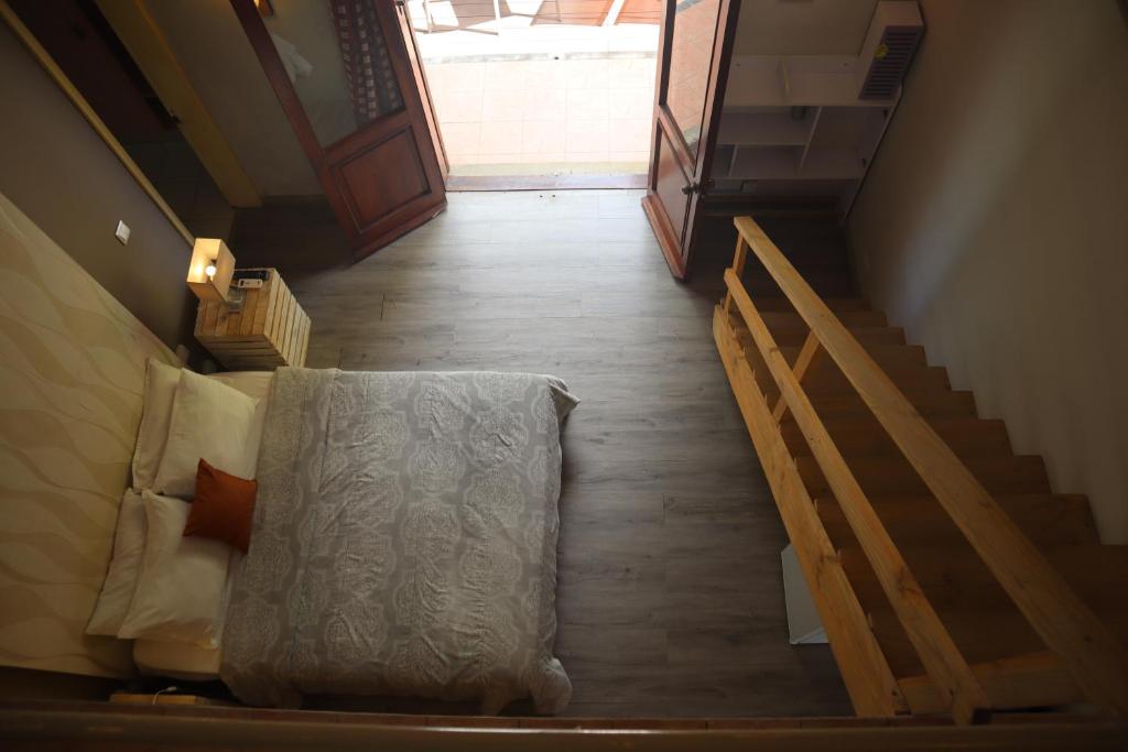 Postel nebo postele na pokoji v ubytování Le Gite du Bonheur Guest House & Car Rental
