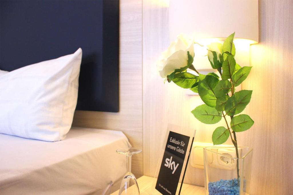 Postel nebo postele na pokoji v ubytování Hotel Altenwerder Hof