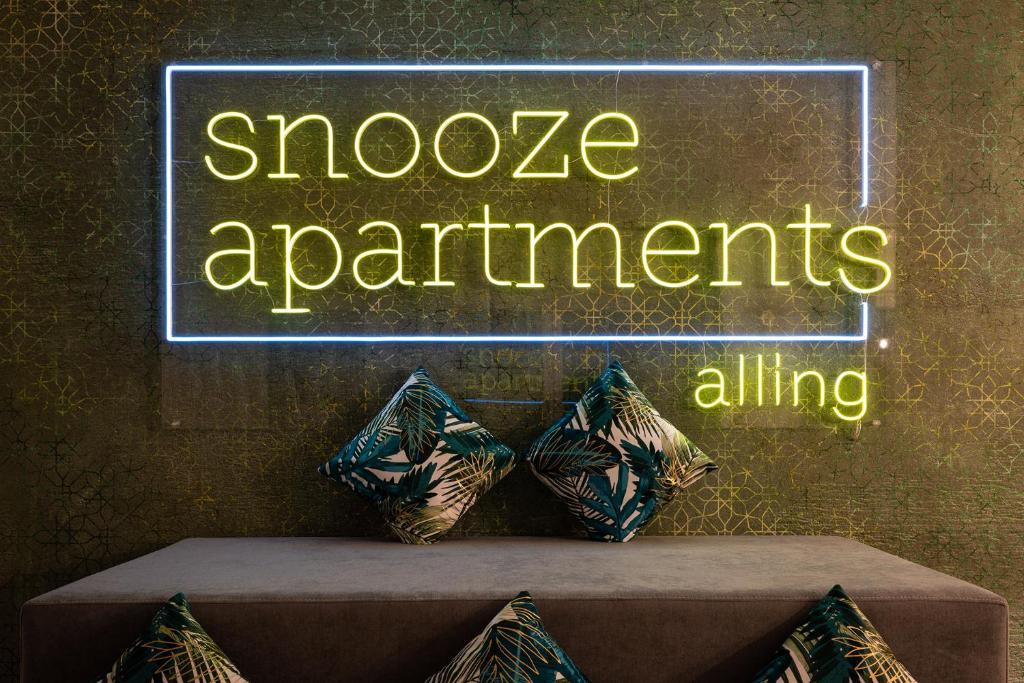 Postel nebo postele na pokoji v ubytování Snooze Apartments Alling