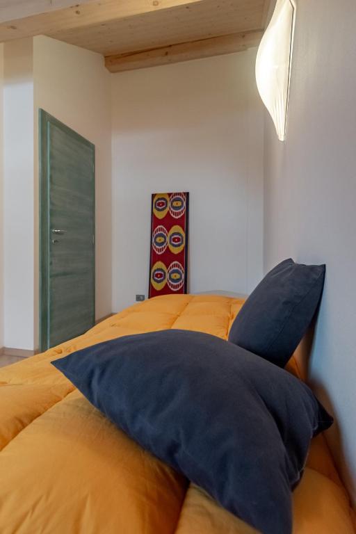 Postel nebo postele na pokoji v ubytování DolomiApartments - Appartamento Orso Bruno