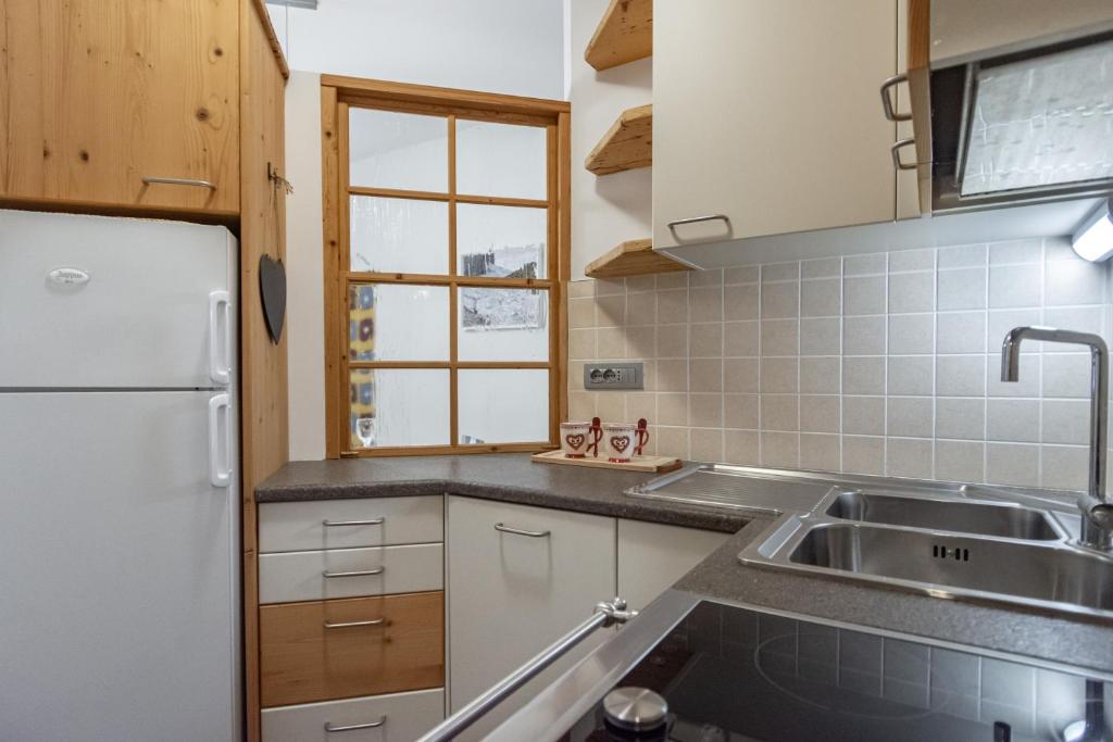 Kuchyň nebo kuchyňský kout v ubytování DolomiApartments - Appartamento Orso Bruno