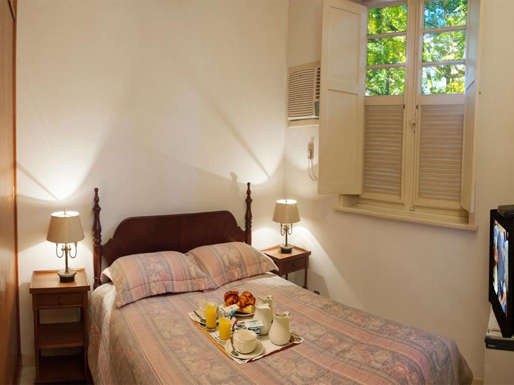 Postel nebo postele na pokoji v ubytování Leblon The best of Brazil