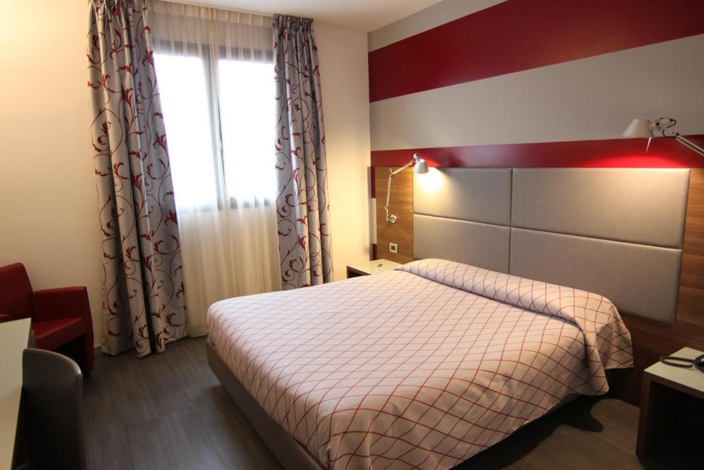 Postel nebo postele na pokoji v ubytování Hotel Del Parco