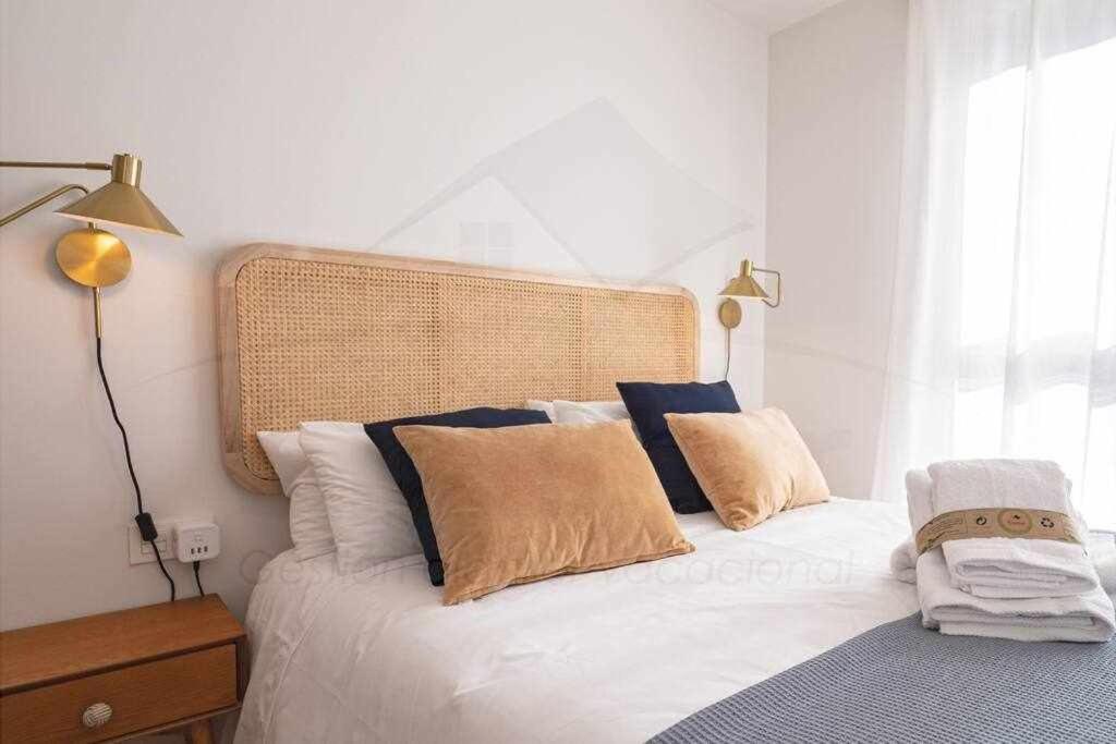 A bed or beds in a room at La Atalaya de Xixón