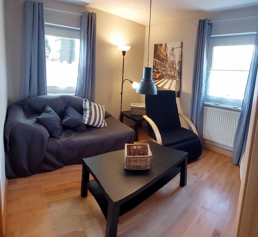 a living room with a couch and a table at Ferienhaus Schafhof in Bad Steben