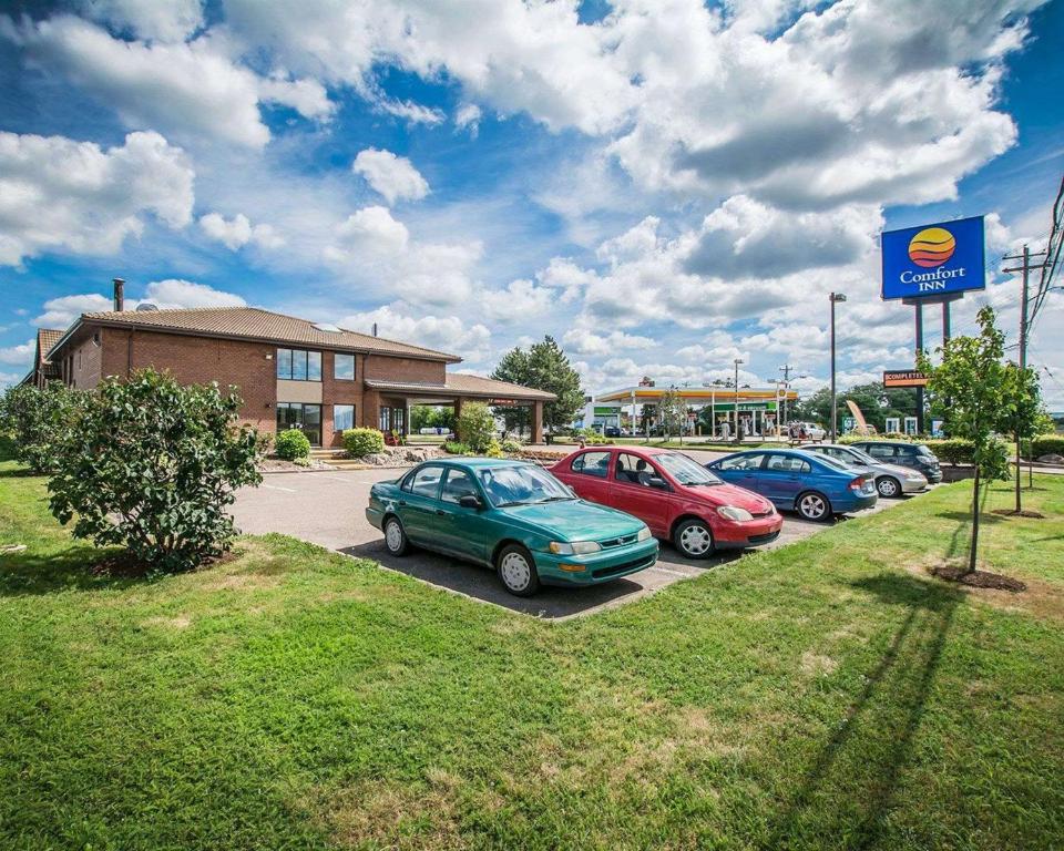 a group of cars parked in a parking lot at Comfort Inn Truro in Truro