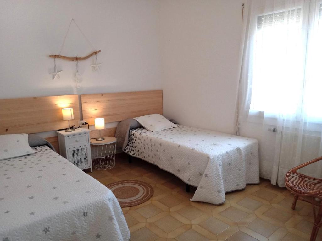 A bed or beds in a room at Villa Tres Cales