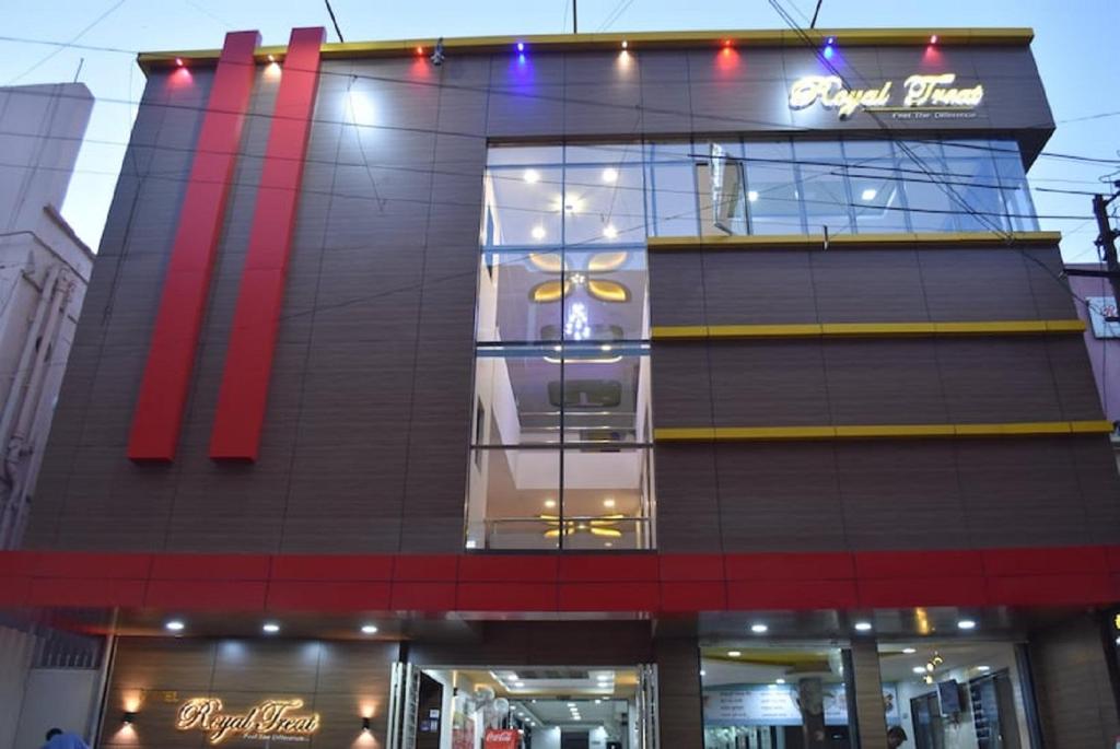 a building with a sign on the side of it at Hotel Royal Treat in Kolhapur