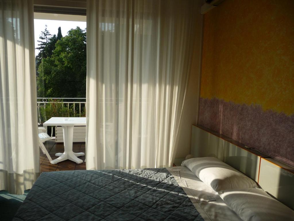 Postel nebo postele na pokoji v ubytování Hotel Luna