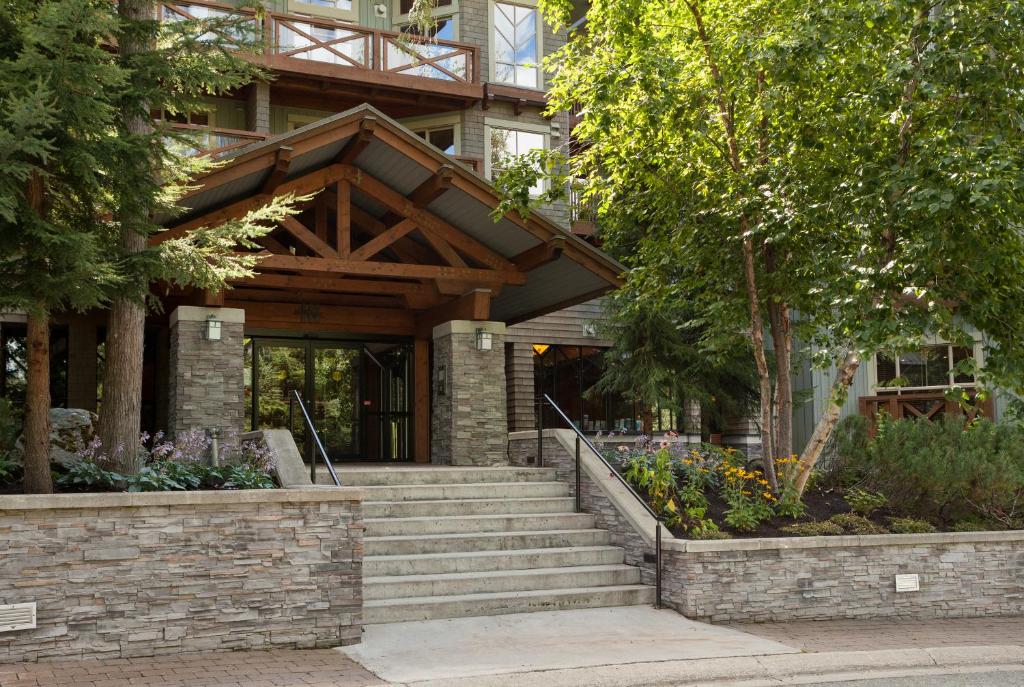 a building with stairs leading to the front door at Horstman House by Whistler Premier in Whistler