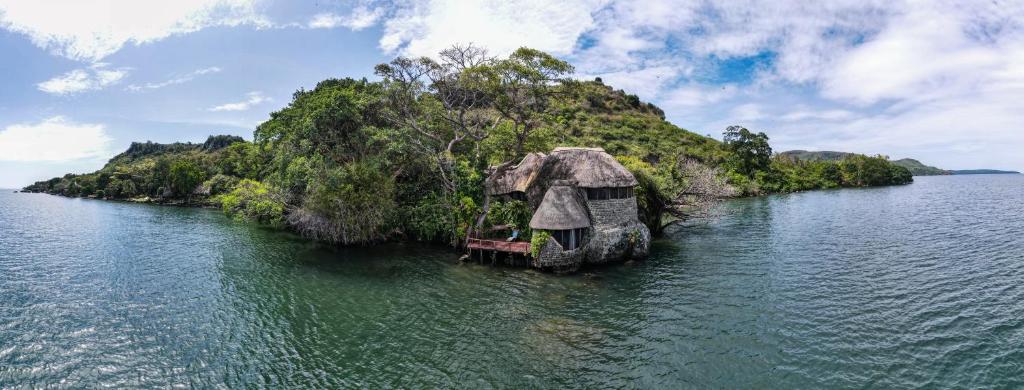 an island in the middle of a body of water at Mfangano Island Lodge in Mbita