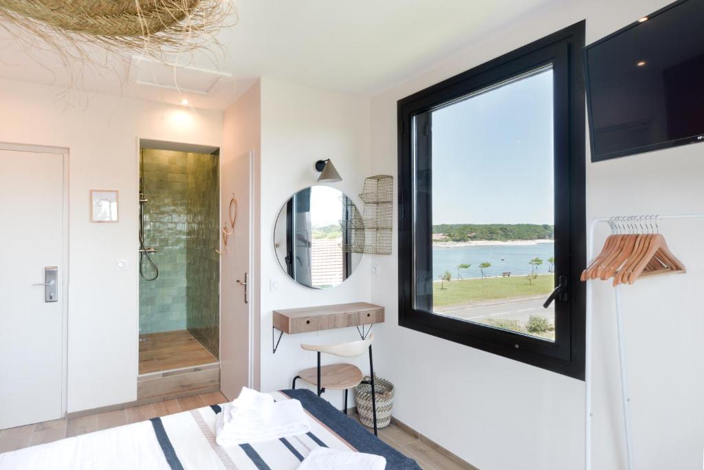 Postel nebo postele na pokoji v ubytování Single Fin Hotel & Lodge
