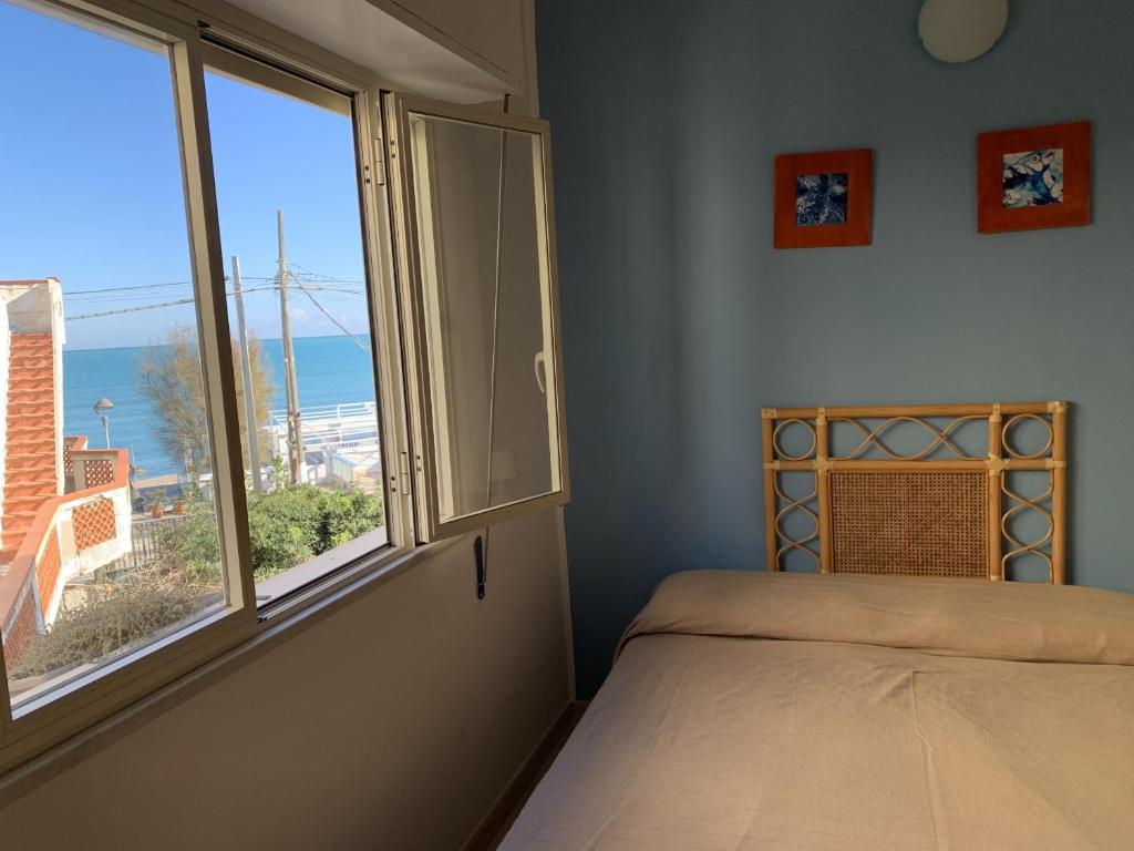 Ένα ή περισσότερα κρεβάτια σε δωμάτιο στο Hotel Il Triangolo