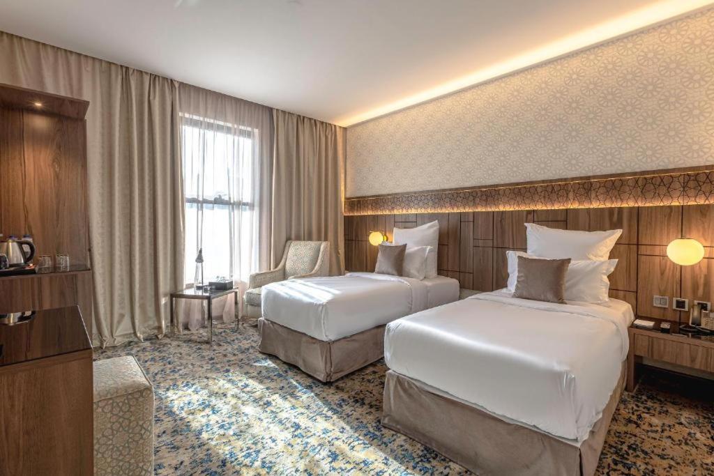Katil atau katil-katil dalam bilik di فندق سما المدينة