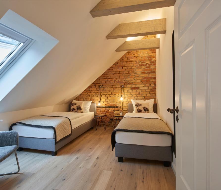 Postel nebo postele na pokoji v ubytování VIA`s Appartements und Ferienwohnungen