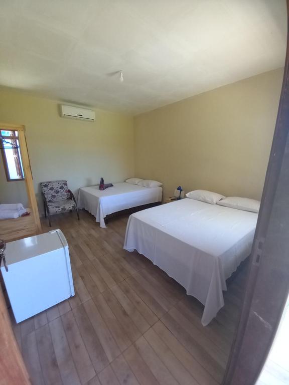 Postel nebo postele na pokoji v ubytování Vila Itacimirim