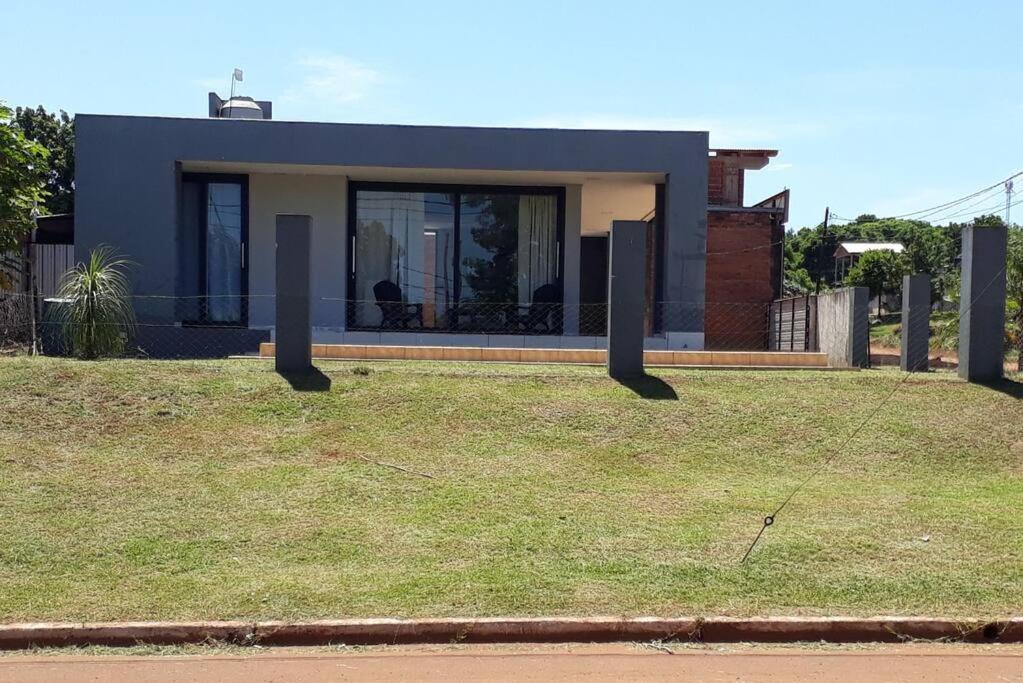 a house sitting on top of a field of grass at Casa moderna estilo minimalista muy luminosa in San Javier