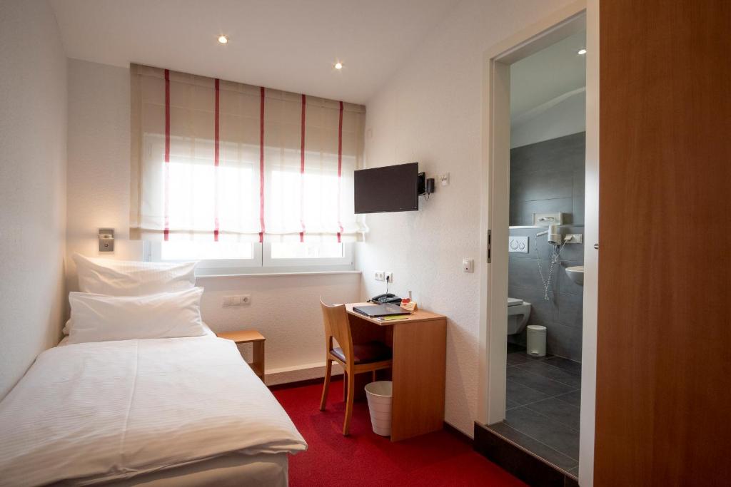 Postel nebo postele na pokoji v ubytování Hotel Elysee
