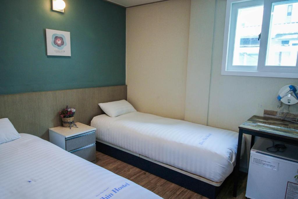 Postel nebo postele na pokoji v ubytování Dongdaemun Hwashin Hostel