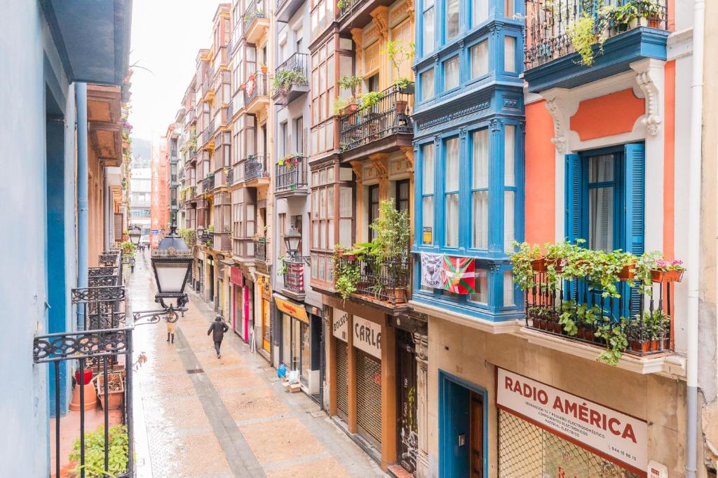 a narrow street in a city with buildings at Beautiful Old Town by Next Stop Bilbao in Bilbao