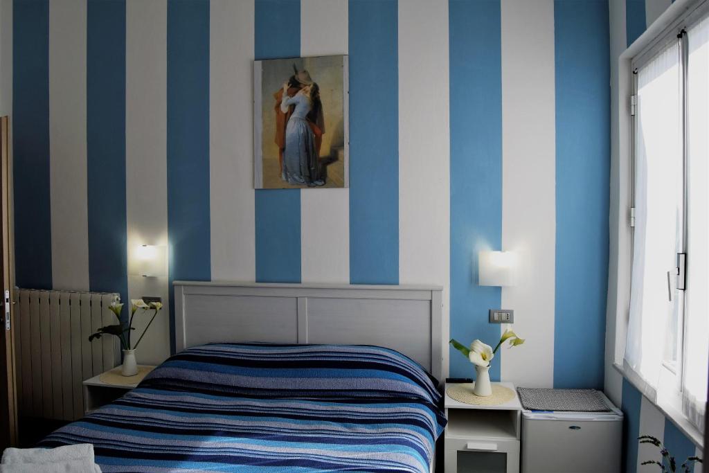 Postel nebo postele na pokoji v ubytování Levante Blu