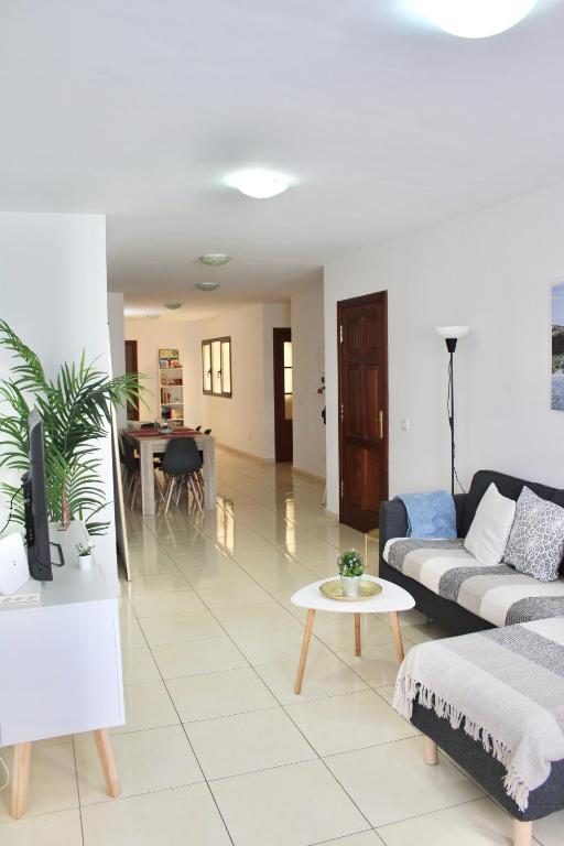 a living room with a couch and a table at La Guarida de Alcalán in Alcalá