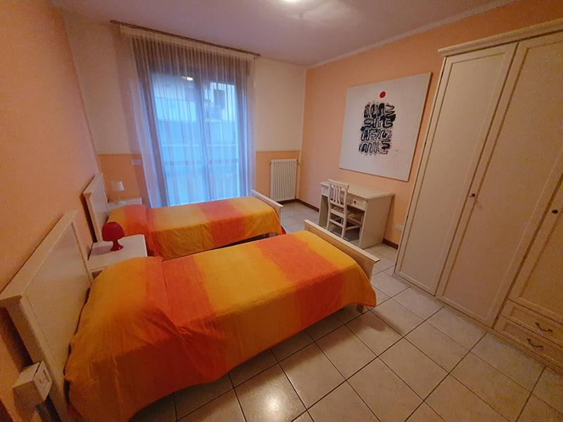 Postel nebo postele na pokoji v ubytování Ferretti Residence Garda Palace