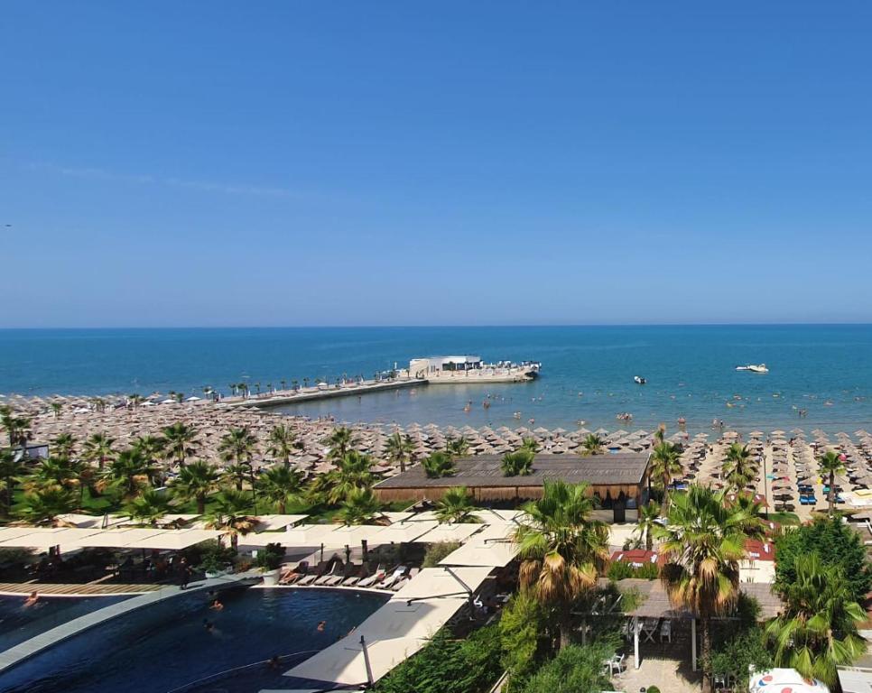 a view of a beach with a pier and the ocean at Apartment in Qerret in Golem