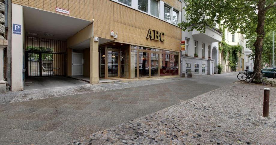 an empty street in front of a building at Pension ABC in Berlin