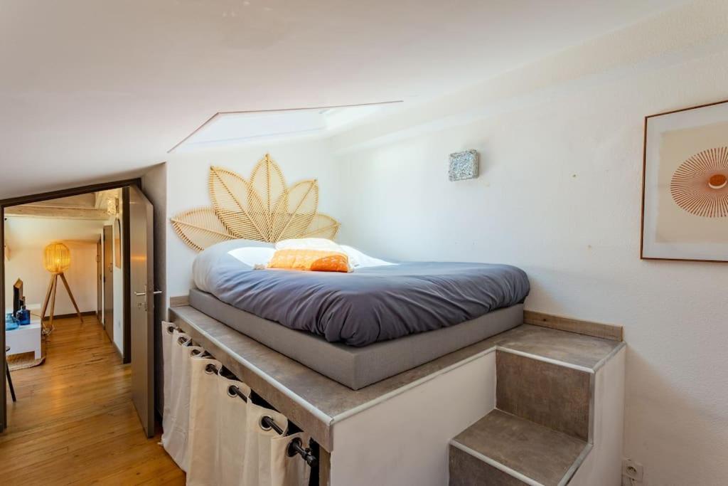 Кровать или кровати в номере Le Nid Azuré / Hypercentre