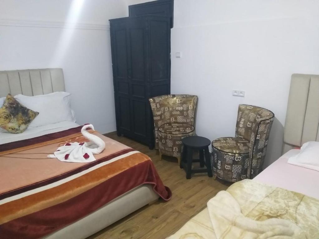 Postel nebo postele na pokoji v ubytování Hôtel Agnaou