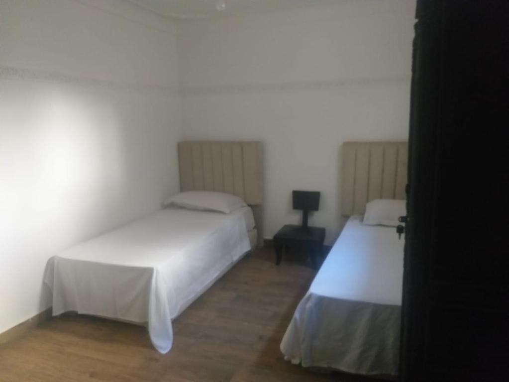 Postel nebo postele na pokoji v ubytování Hôtel Agnaou