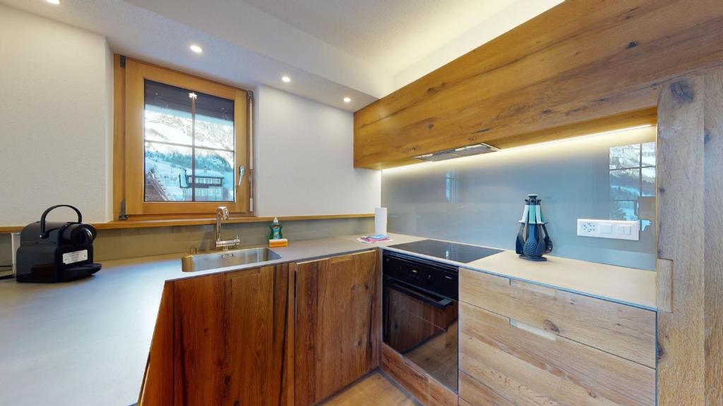Kuchyň nebo kuchyňský kout v ubytování Haus Marietta - Leukerbad