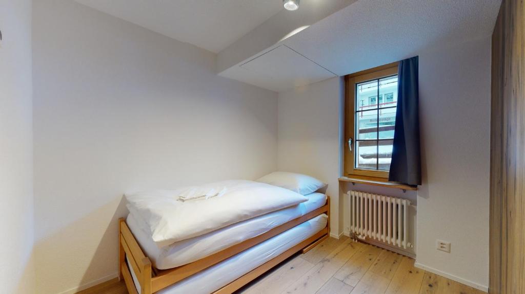 Postel nebo postele na pokoji v ubytování Haus Marietta - Leukerbad