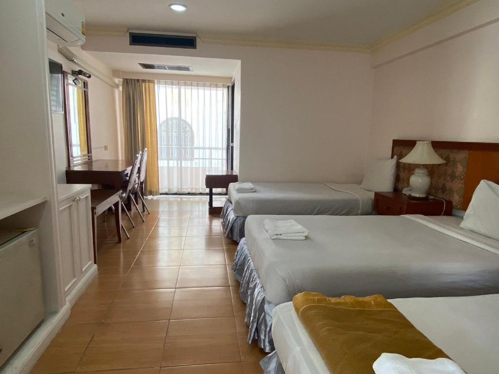 Postel nebo postele na pokoji v ubytování Jumbotel Hotel