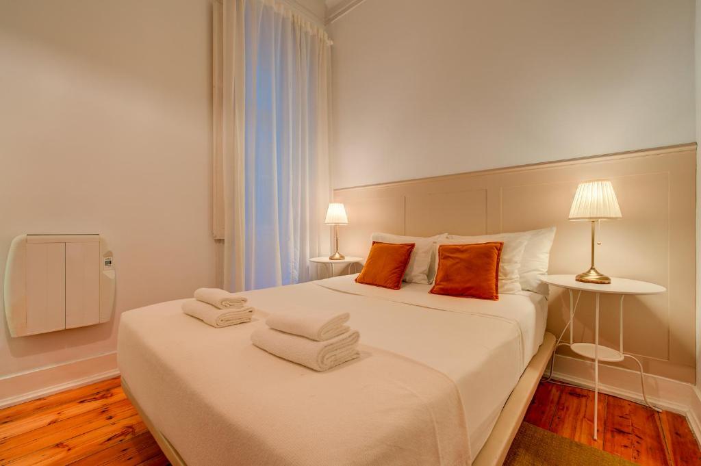 Postel nebo postele na pokoji v ubytování Chalet D´Ávila Guest House
