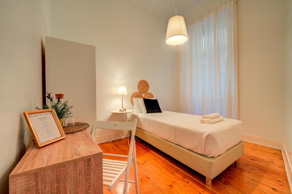 Postel nebo postele na pokoji v ubytování Chalet D´Ávila Guest House