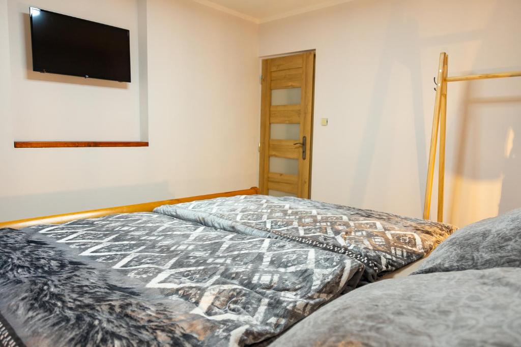 Letto o letti in una camera di Prázdninový dům Valdík