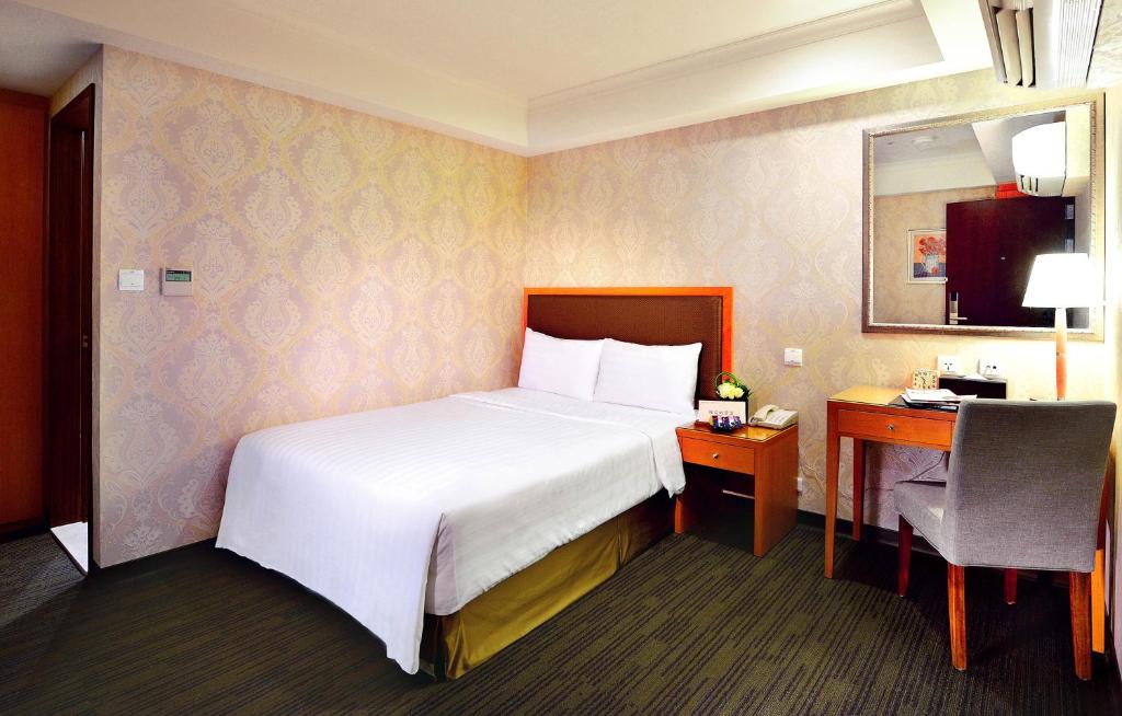 Postel nebo postele na pokoji v ubytování Fuward Hotel Tainan