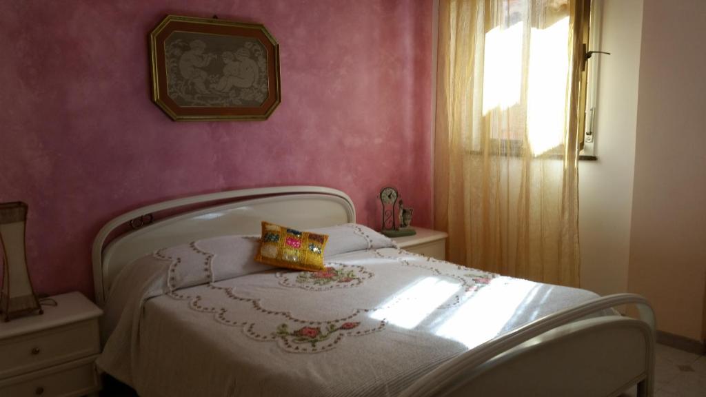 Кровать или кровати в номере Appartamento Maria Giovanna