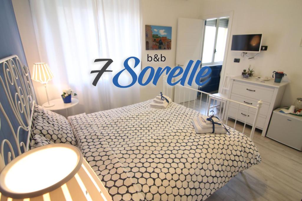 En eller flere senge i et værelse på "7 SORELLE B&B" camere in pieno centro città con bagno privato, FREE HIGH SPEED WI-FI, NETFLIX