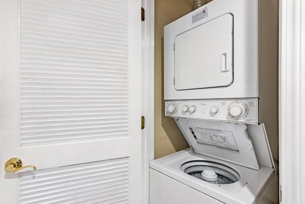 a white washer and dryer in a small bathroom at 2 King BRs Balcony Resort Amenities Free Tix in Pigeon Forge
