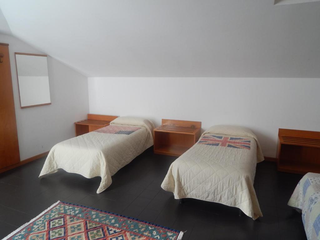 Postel nebo postele na pokoji v ubytování Hotel Aurora