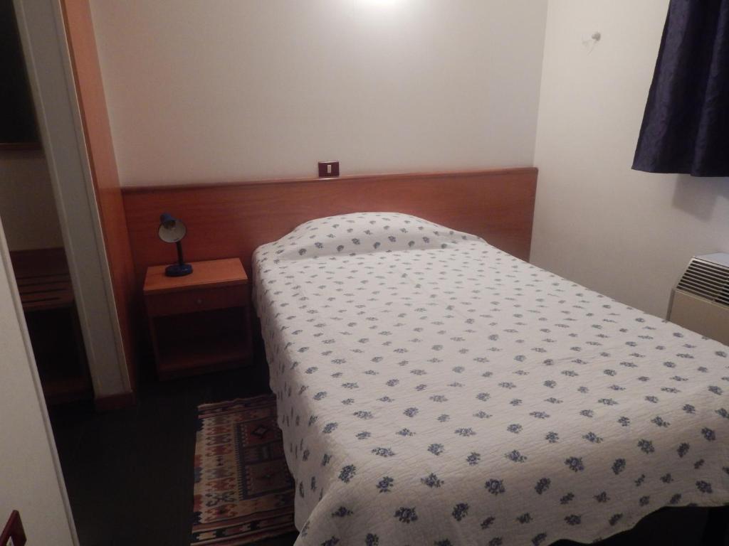 Postel nebo postele na pokoji v ubytování Hotel Aurora