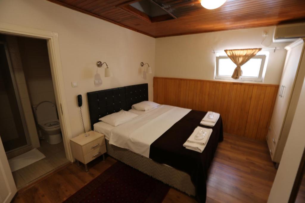 a bedroom with a large bed and a bathroom at Private Room in Istanbul #53 in Istanbul