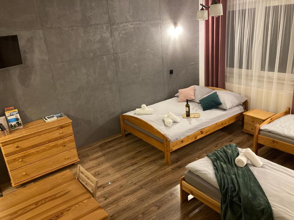 Postel nebo postele na pokoji v ubytování Agroturystyka u Podnóża Góry Cergowej