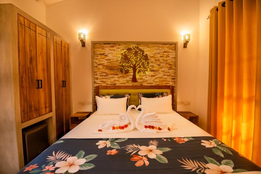 Postel nebo postele na pokoji v ubytování Tree of Life Resort